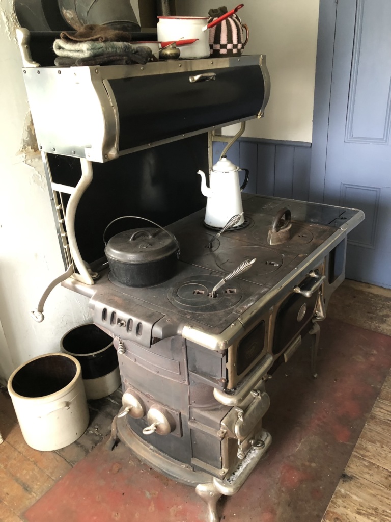 A wonderful heavy wood stove all ready for cooking.
